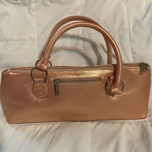 Insulated wine purse with bottle opener.